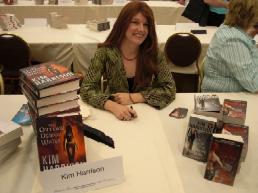 Kim at signing table